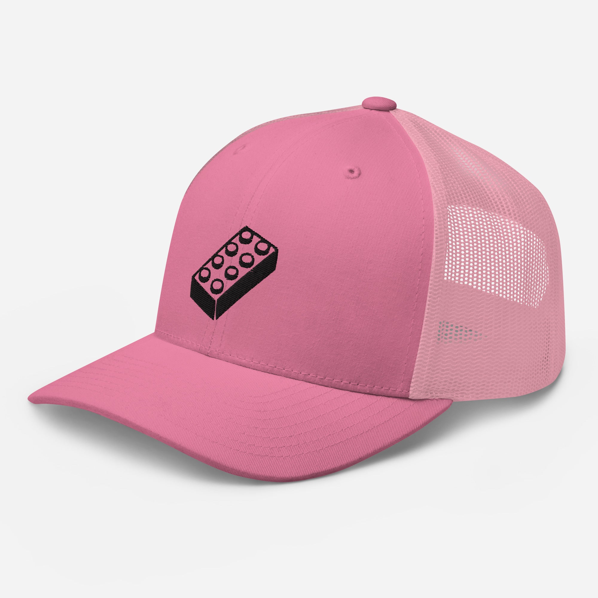 a pink trucker cap with a lego embroidered brick design